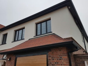 black-continuous-guttering-aluminium-downpipes